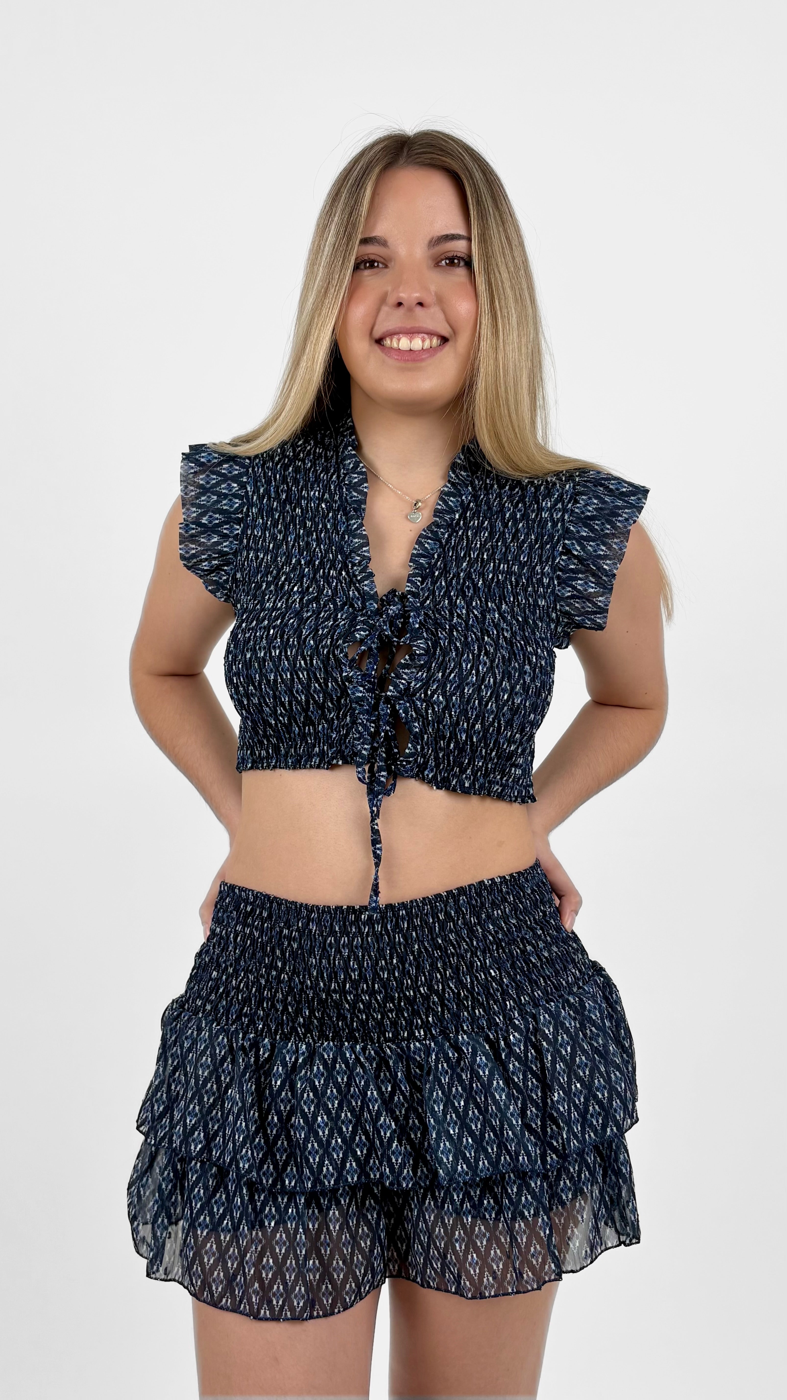 Minifalda pantalón volantes estampado azul marino